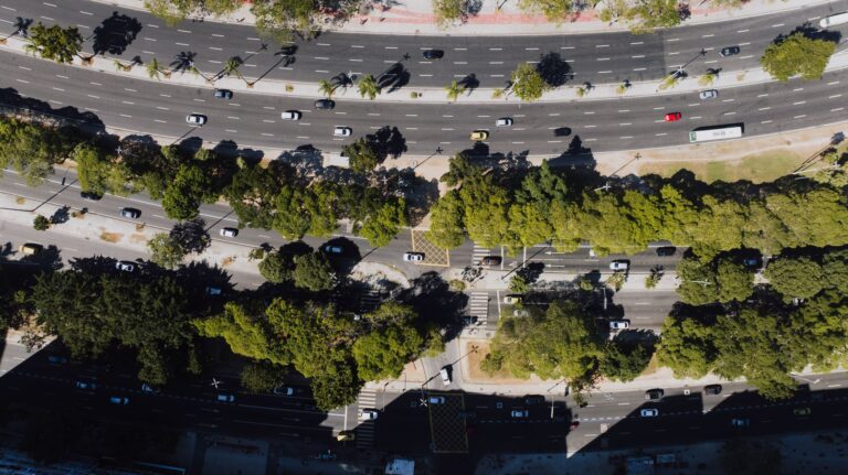 A birds-eye view of busy streets and lush greenery in Rio de Janeiro, Brazil.
