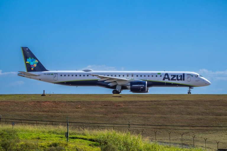 Azul Airlines Embraer jet ready for takeoff on a sunny day.