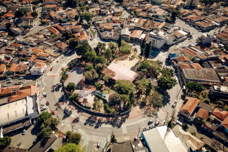Stunning aerial view of Jardim Vila Galvao showing the town square surrounded by urban architecture.